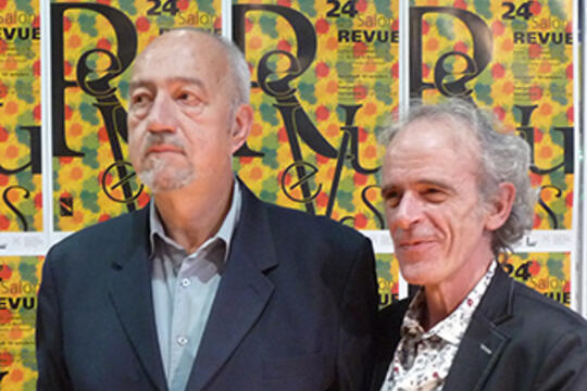 Au 24e Salon de la revue, en 2014 : Bernard Condominas, président d’Ent’revues et André Chabin, directeur.